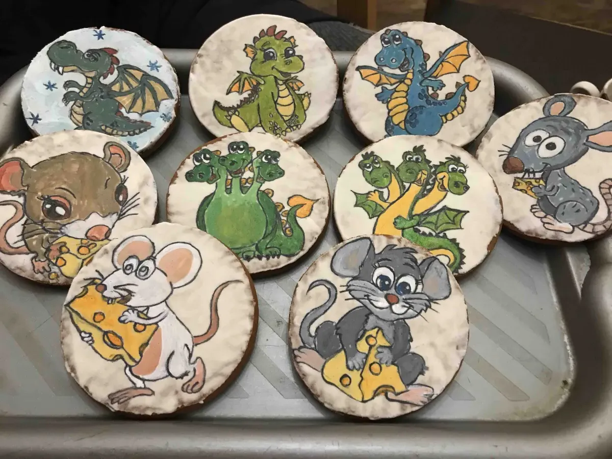 Hand-painted dinosaur and mouse cookies