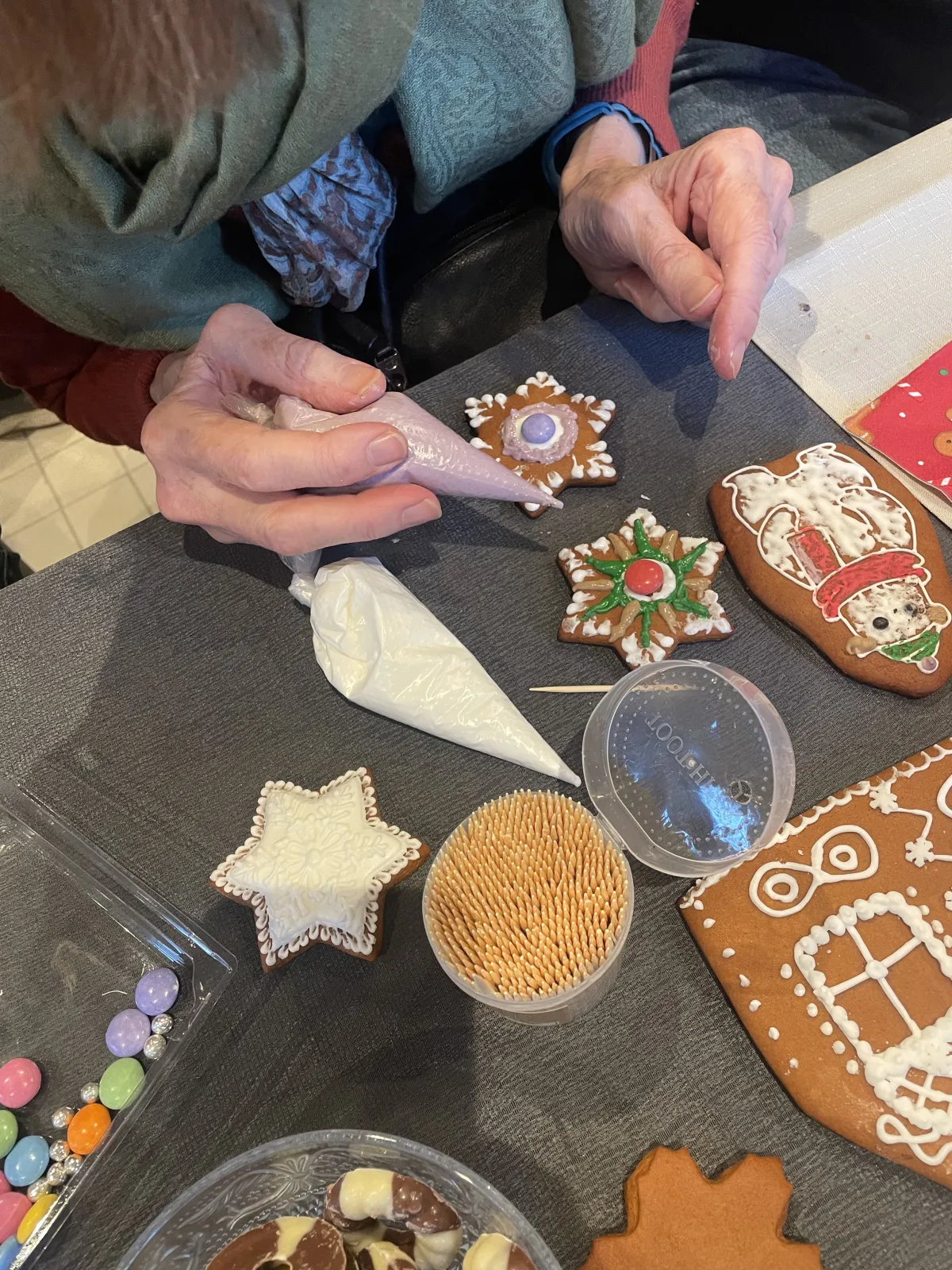 Decorating snowflake cookies with icing
