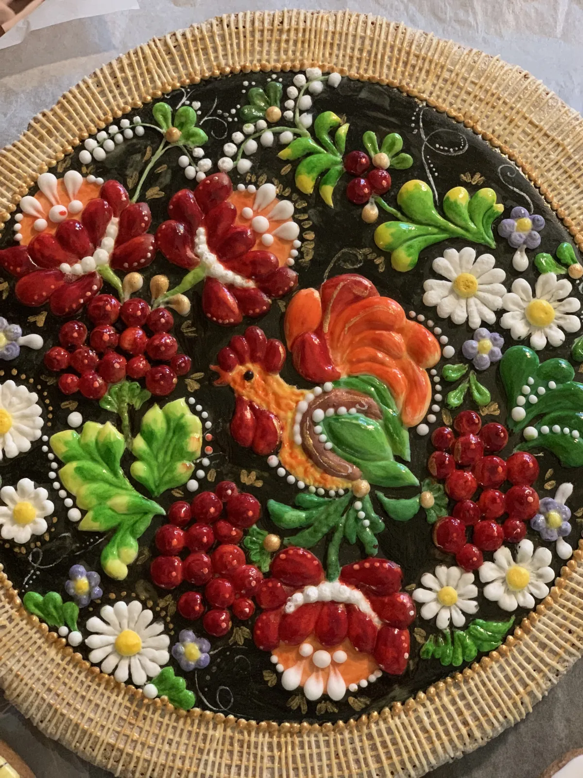 Cookie with colorful kalyna design on black background