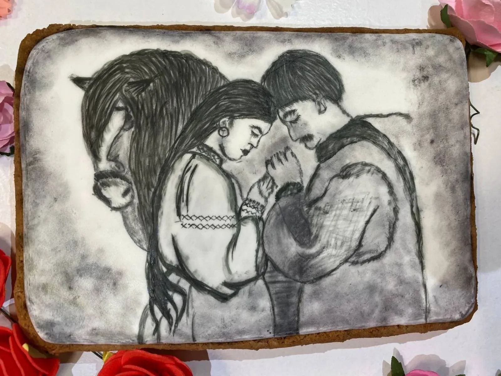 Cookie with sketch-style illustration of a couple