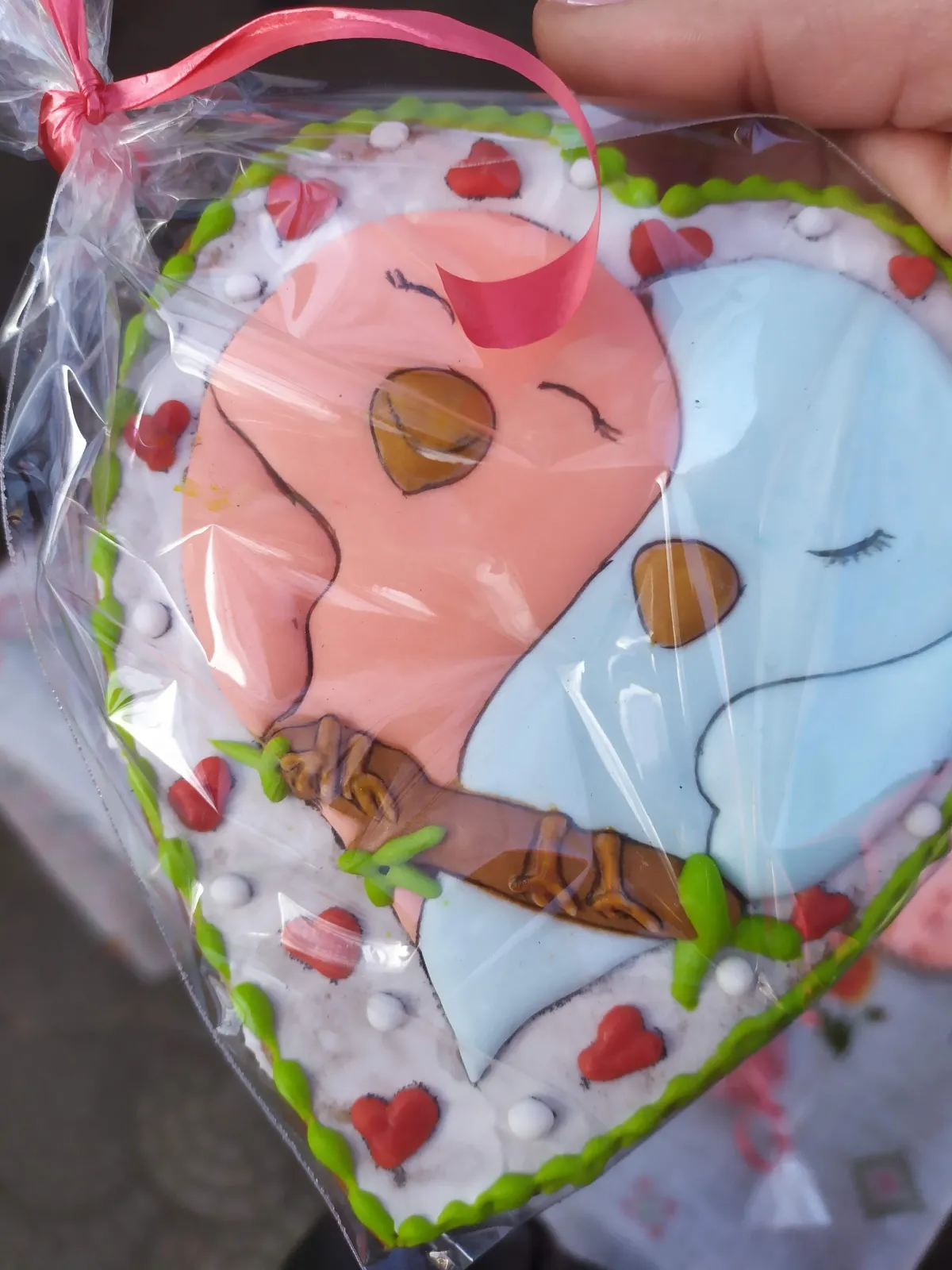 Hand-painted sleeping bird on a branch cookie